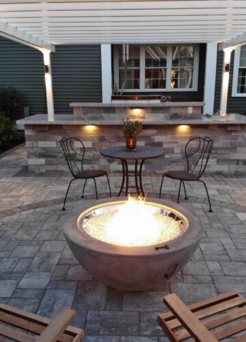 firepit with wood pellets by the pool